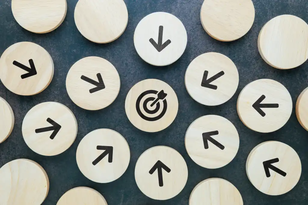 Every arrow wood block points at the same target at the center, all for one purpose, teamwork, business competition, or the  point of communication concept
