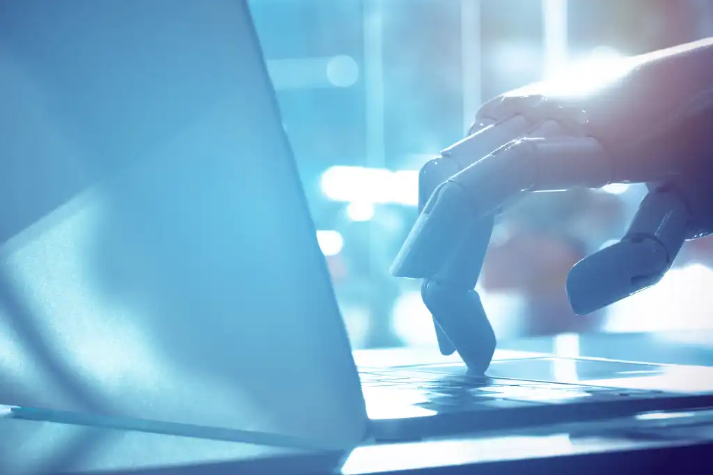 Robot finger point to laptop button with blue tone image. Chat bot , artificial intelligence , robo advisor , robotic concept.